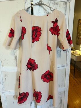 Gabby Skye Beige Mini Dress with Bold Red Floral Motif